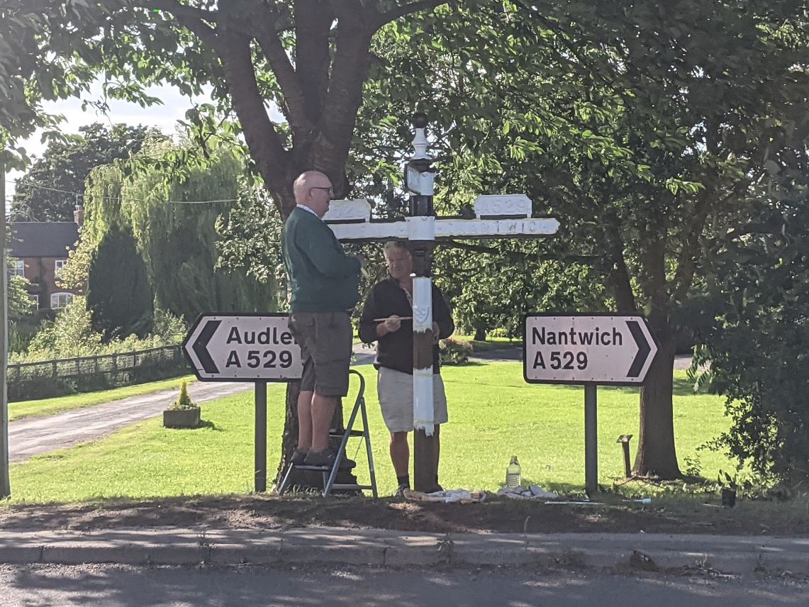 Repainting the finger post, August 6th